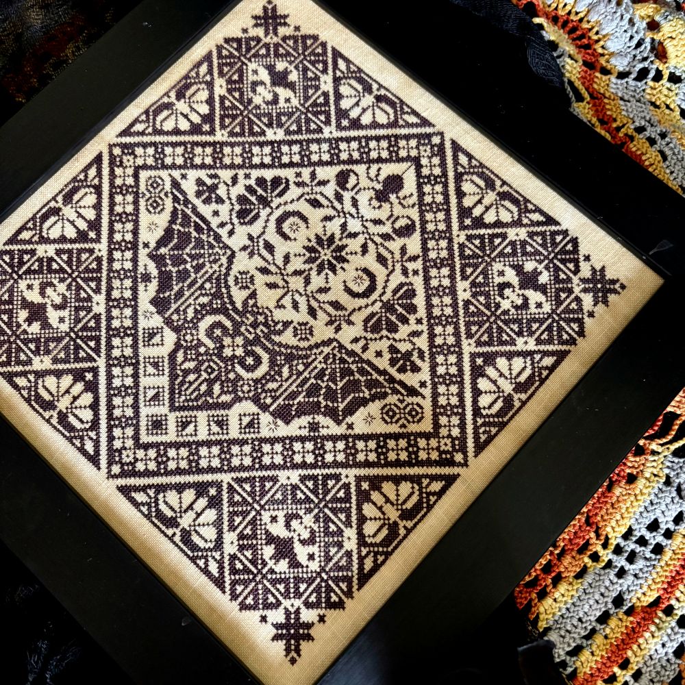 Embroidery with geometric pattern on a black background