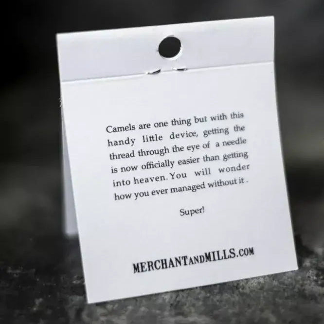 White tag with text on a dark background