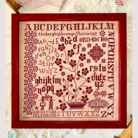 Abecedarian in Red cross-stitch pattern showcasing bold red alphabet letters