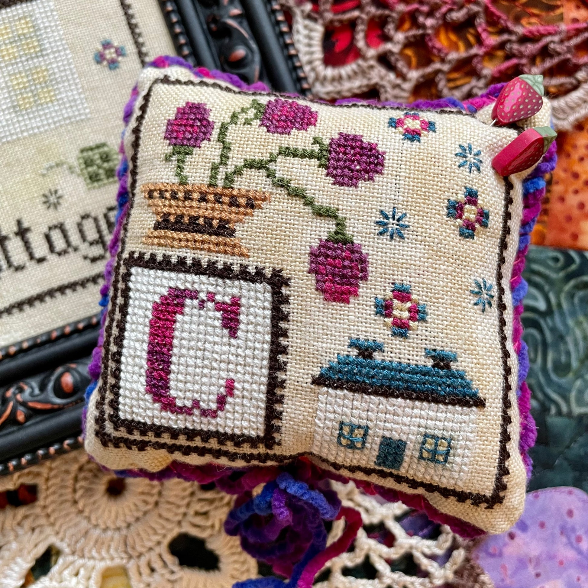 Printed C is for Cottage cross stitch chart featuring a cozy house and alphabet details – physical copy only