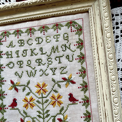 Winter Sampler cross-stitch chart with seasonal motifs – printed only