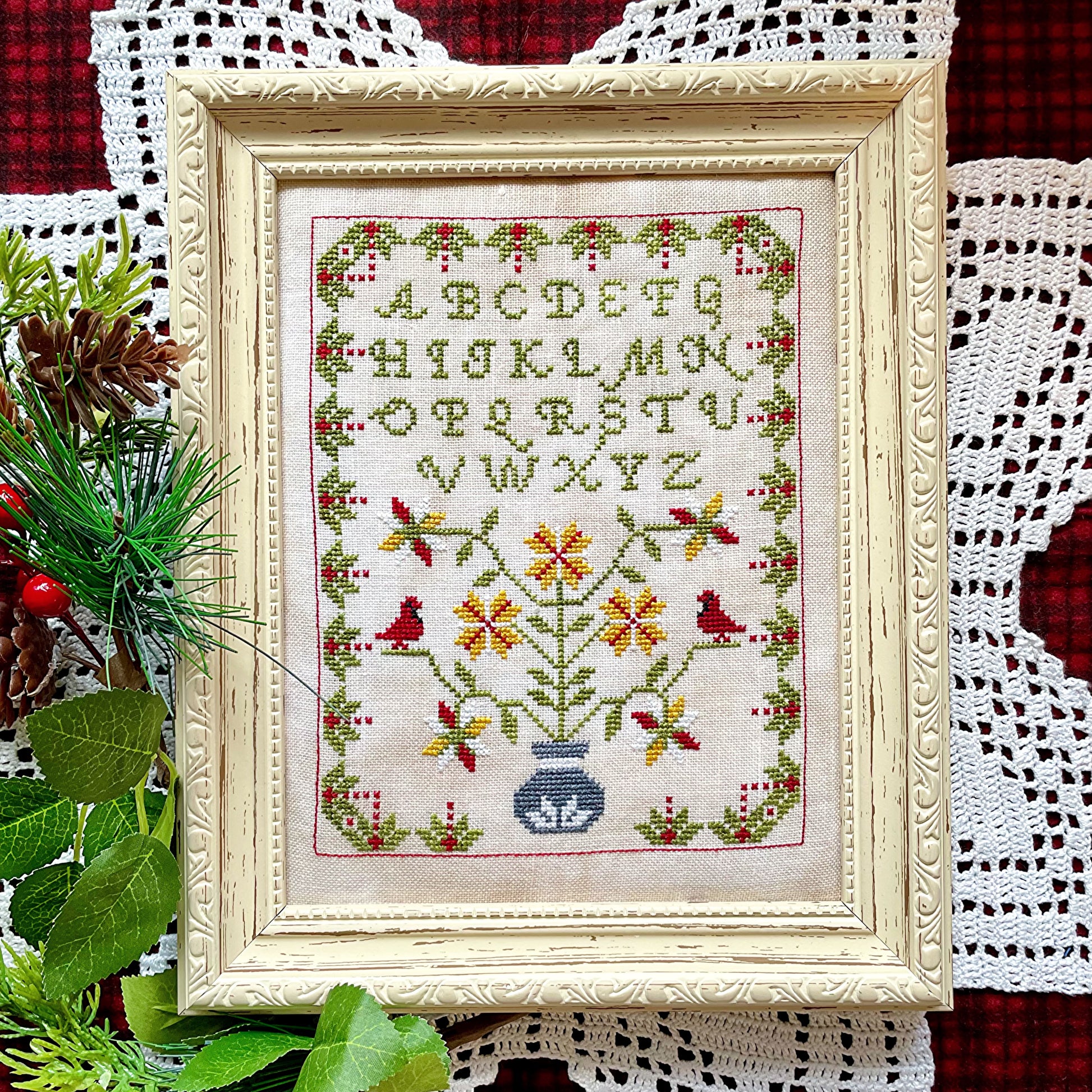 Winter Sampler cross-stitch chart with seasonal motifs – printed only