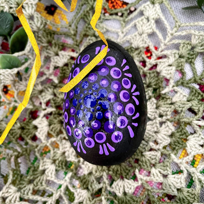 Close-up of hand-painted Easter eggs, showcasing unique designs and vibrant colors.