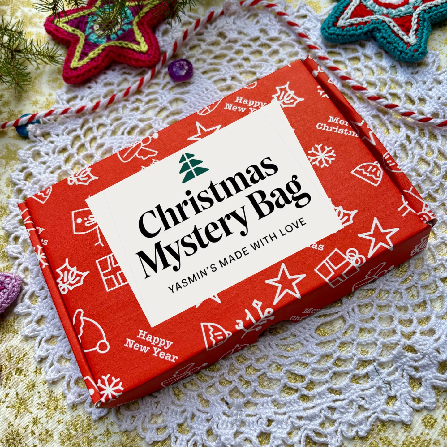 Red Christmas mystery bag with white label on a decorative surface