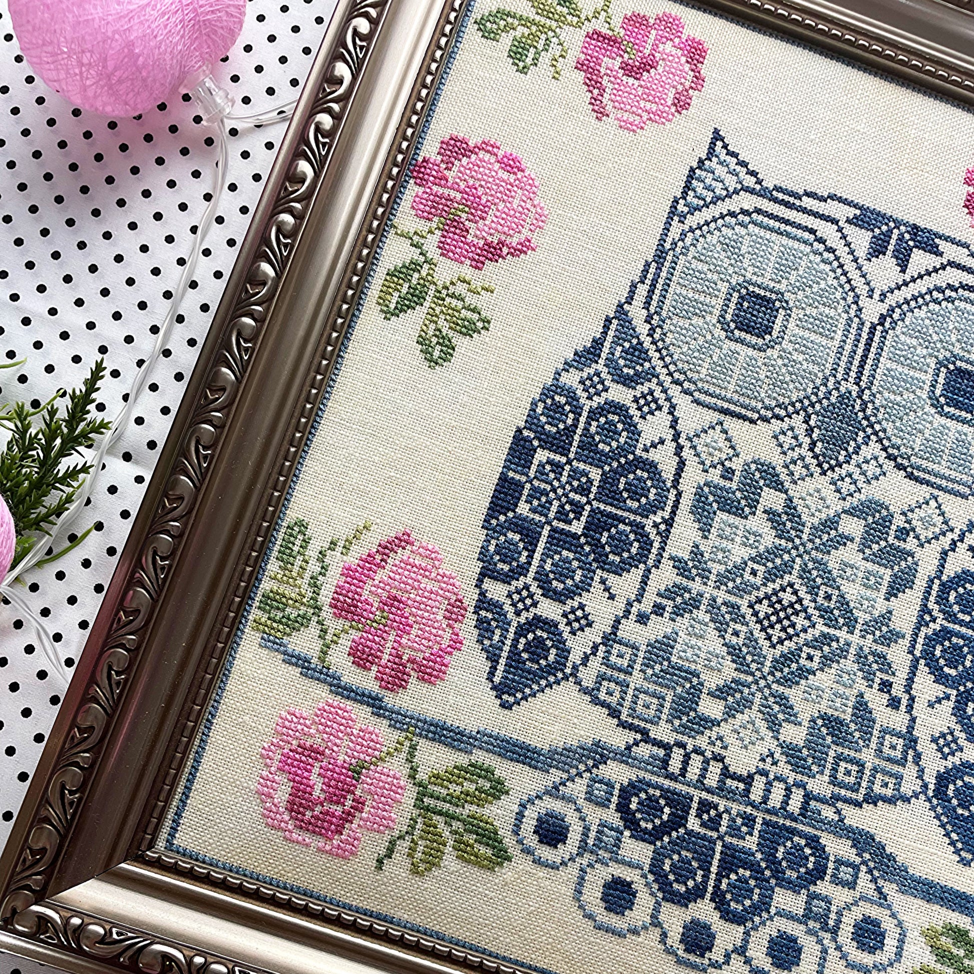 Whimsical Quaker sampler featuring an owl and decorative elements
