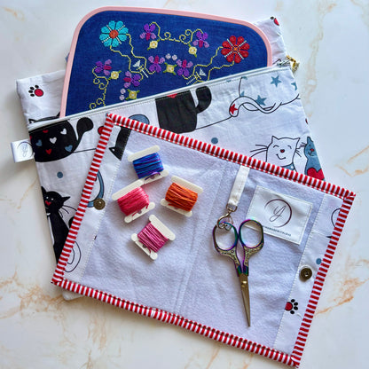Handmade cross-stitch and embroidery project bag crafted from high-quality quilting cotton, featuring a secure zipper and vibrant pattern.