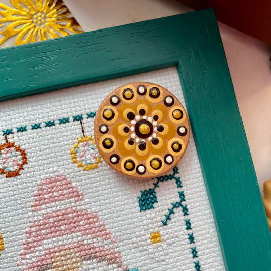 Alt text: Cross stitch pattern featuring coffee and tea motifs with folk-style lettering