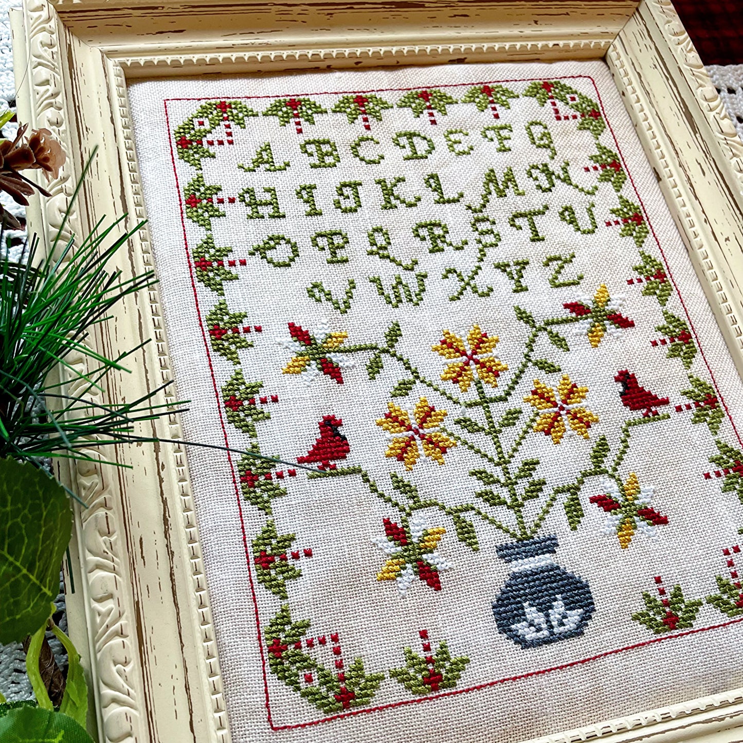 Winter Sampler cross-stitch chart with seasonal motifs – printed only