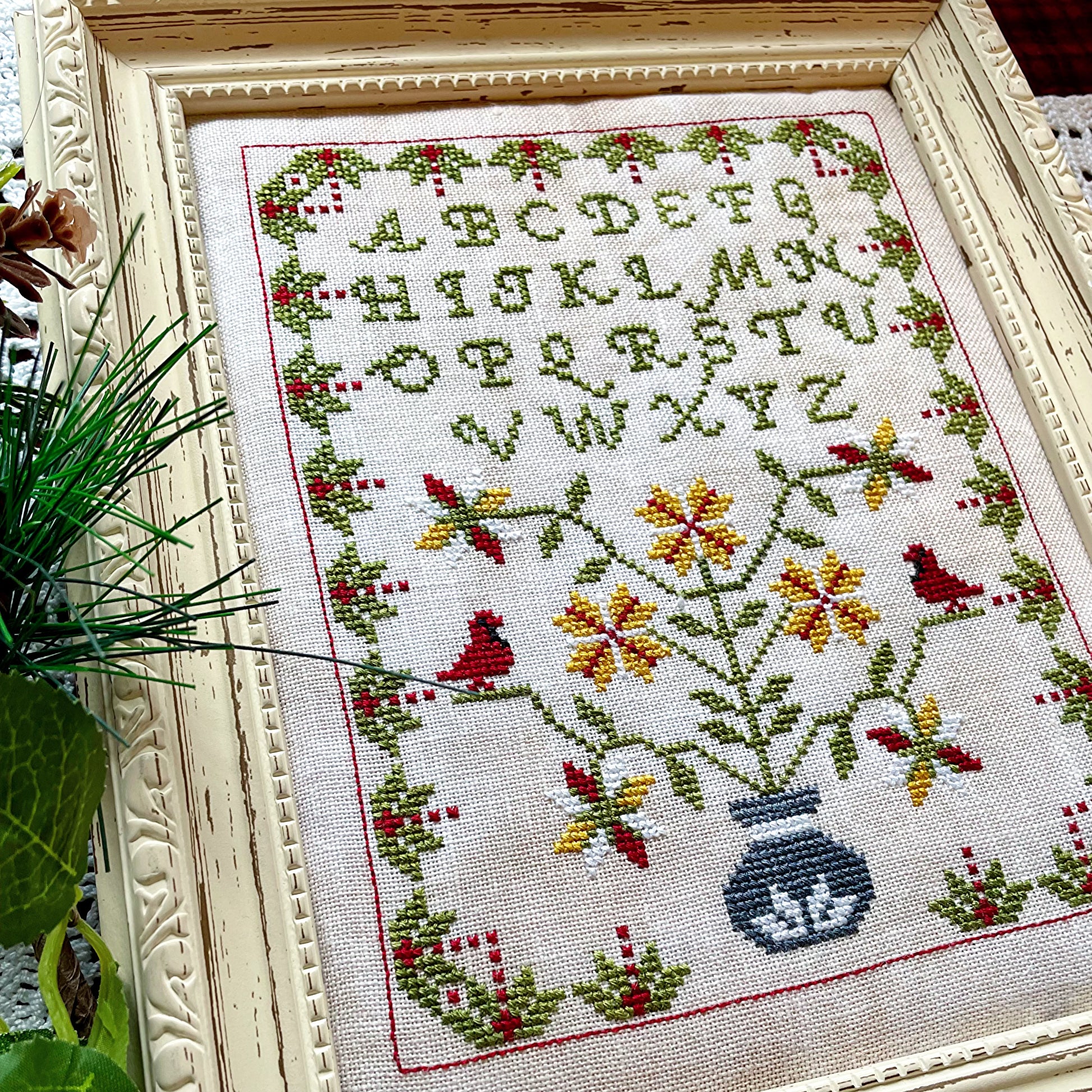 Winter Sampler cross-stitch chart with seasonal motifs – printed only