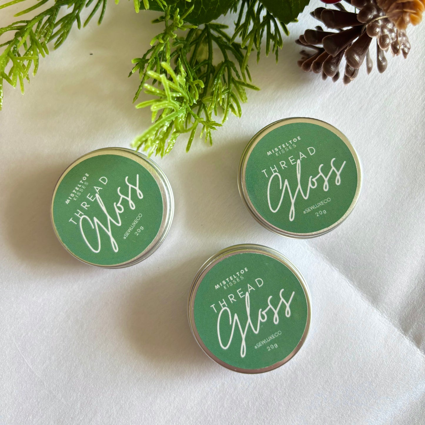 Christmas thread gloss with fresh woody scent