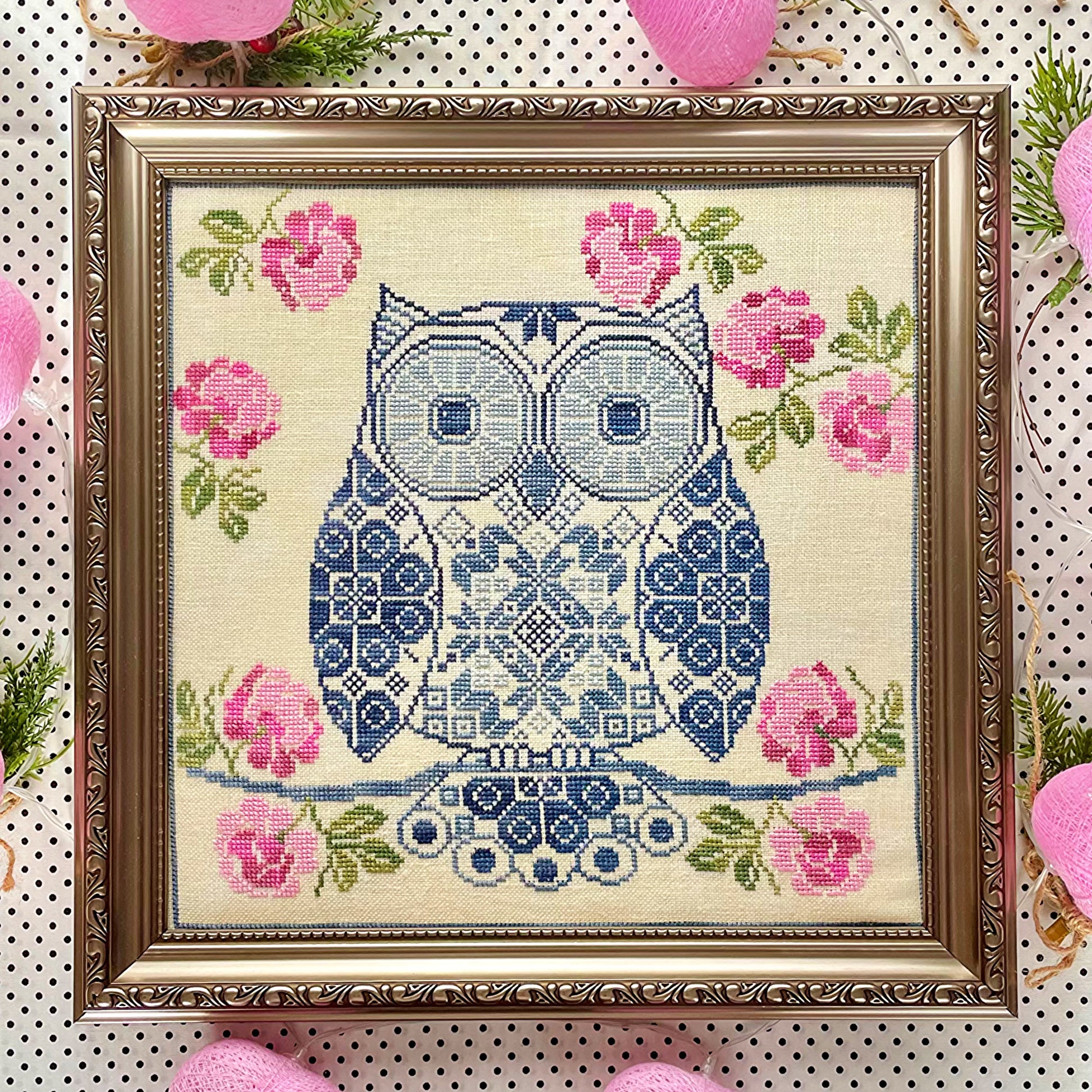 Whimsical Quaker sampler featuring an owl and decorative elements