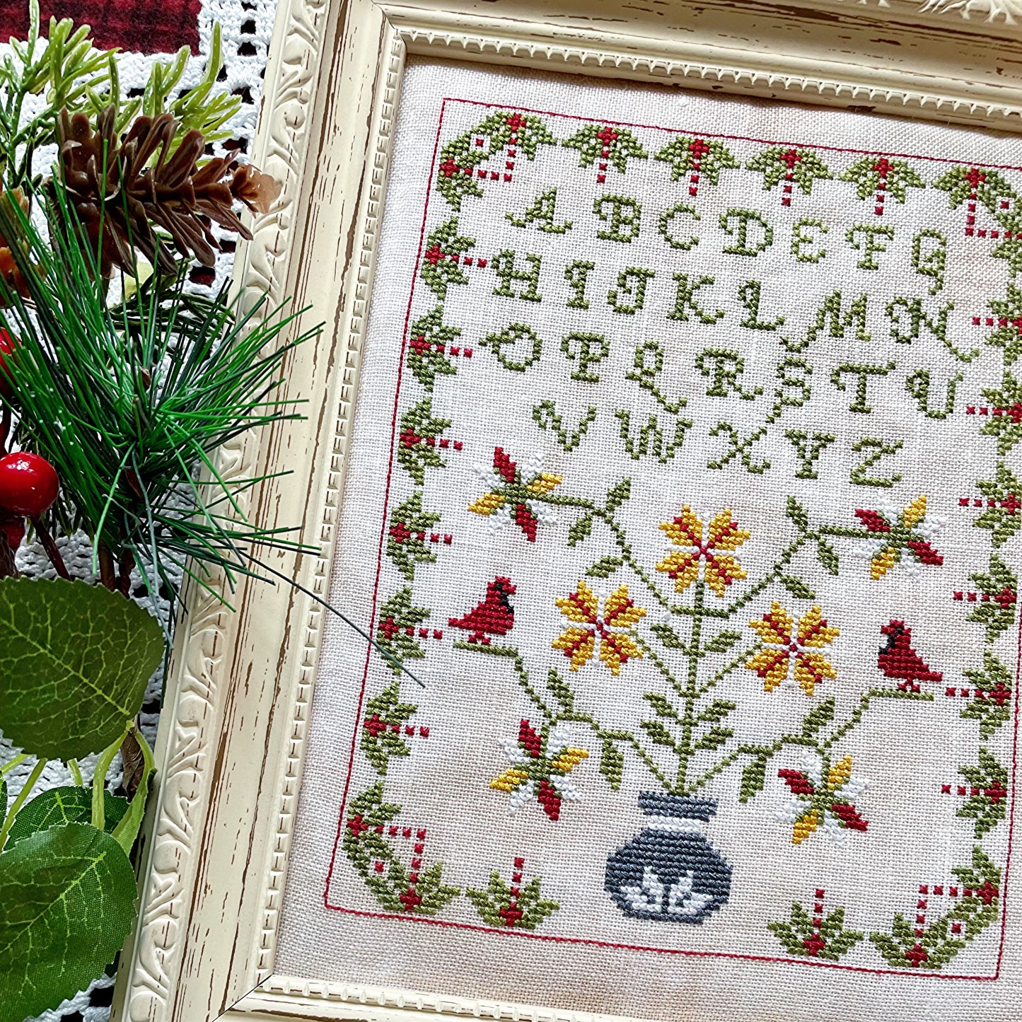 Winter Sampler cross-stitch chart with seasonal motifs – printed only