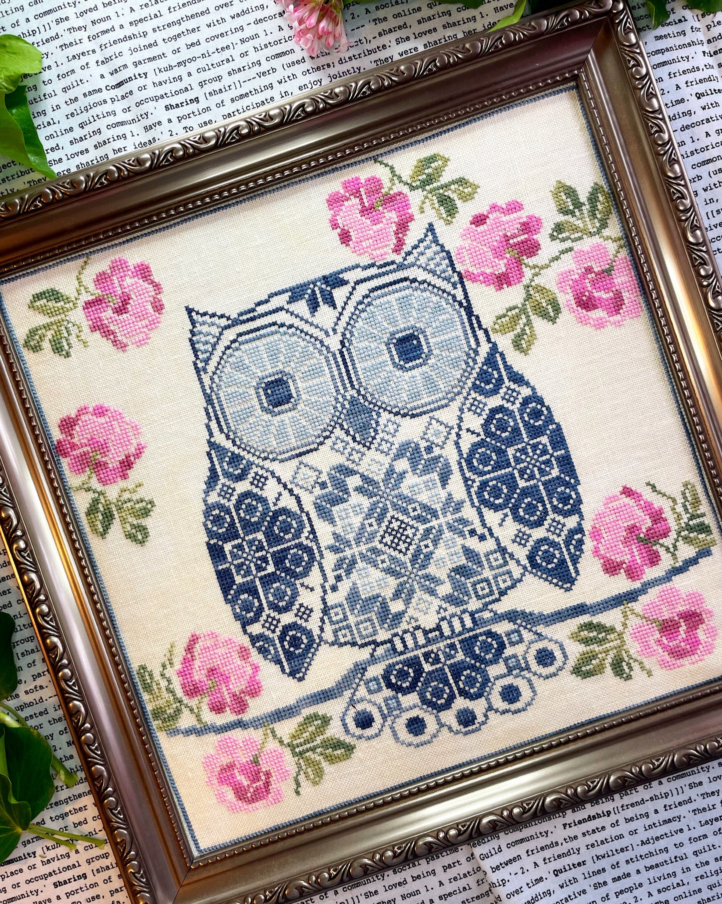 Whimsical Quaker sampler featuring an owl and decorative elements