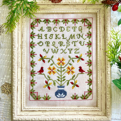 Winter Sampler cross-stitch chart with seasonal motifs – printed only