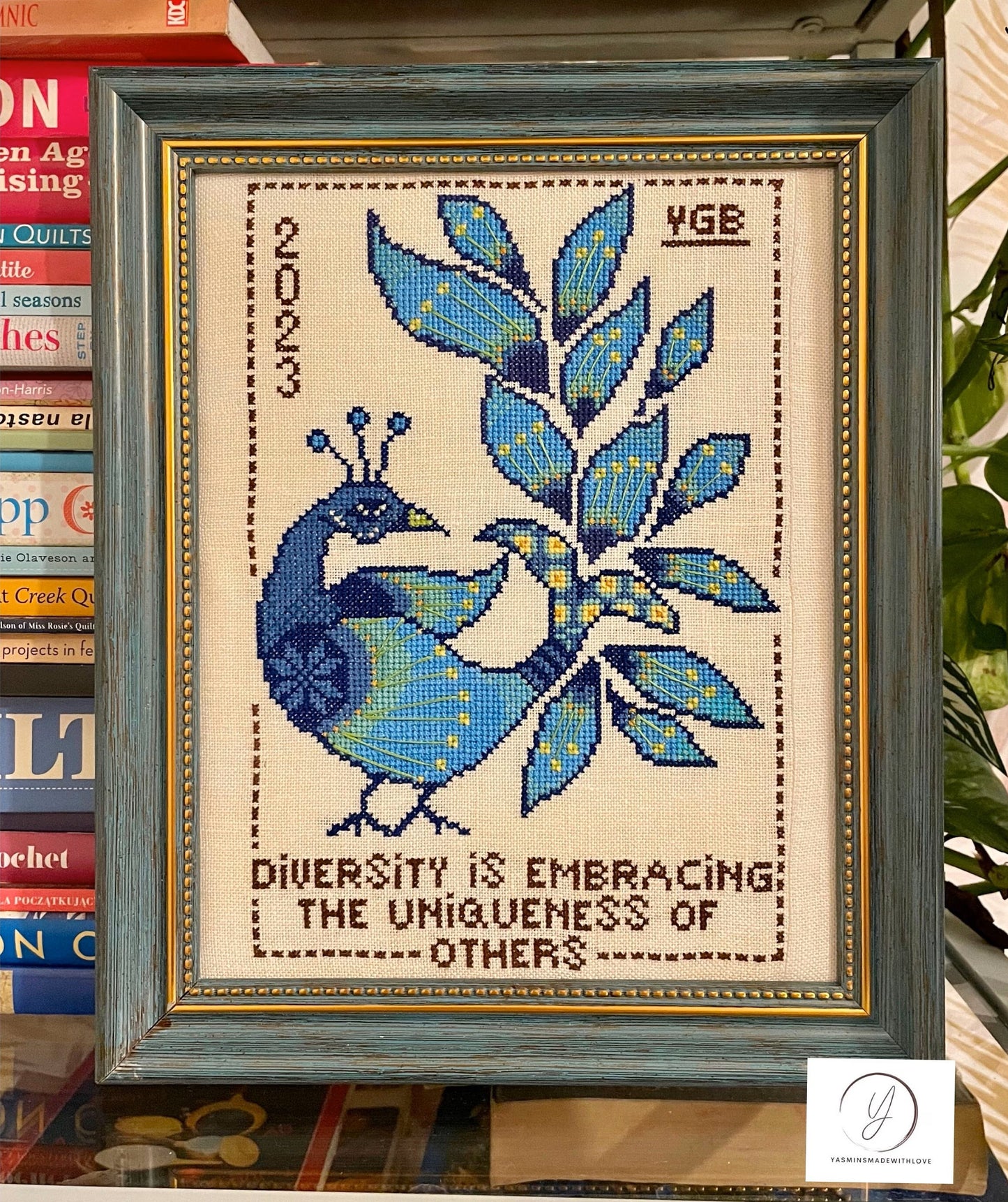 Bird-themed cross-stitch design celebrating individuality and diversity