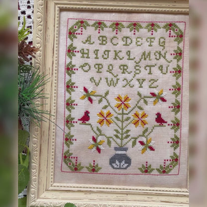 Winter Sampler cross-stitch chart with seasonal motifs – printed only