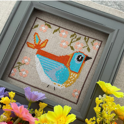 Summer Folk Bird cross-stitch chart featuring a bird and seasonal floral motifs