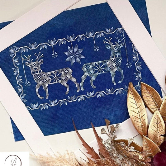 Winter Deer cross-stitch chart with folk-style deer and winter florals – PDF or printed