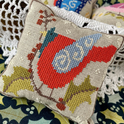 Physical-only cross-stitch chart featuring winter bird from Folk Birds Series